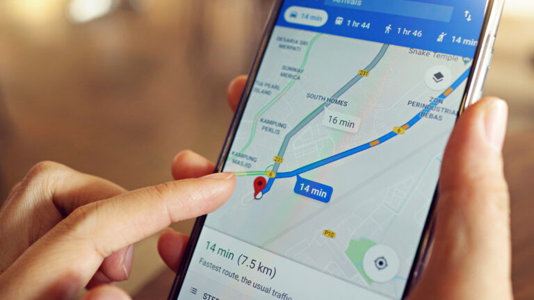 How do I track a mobile phone using Google Maps?