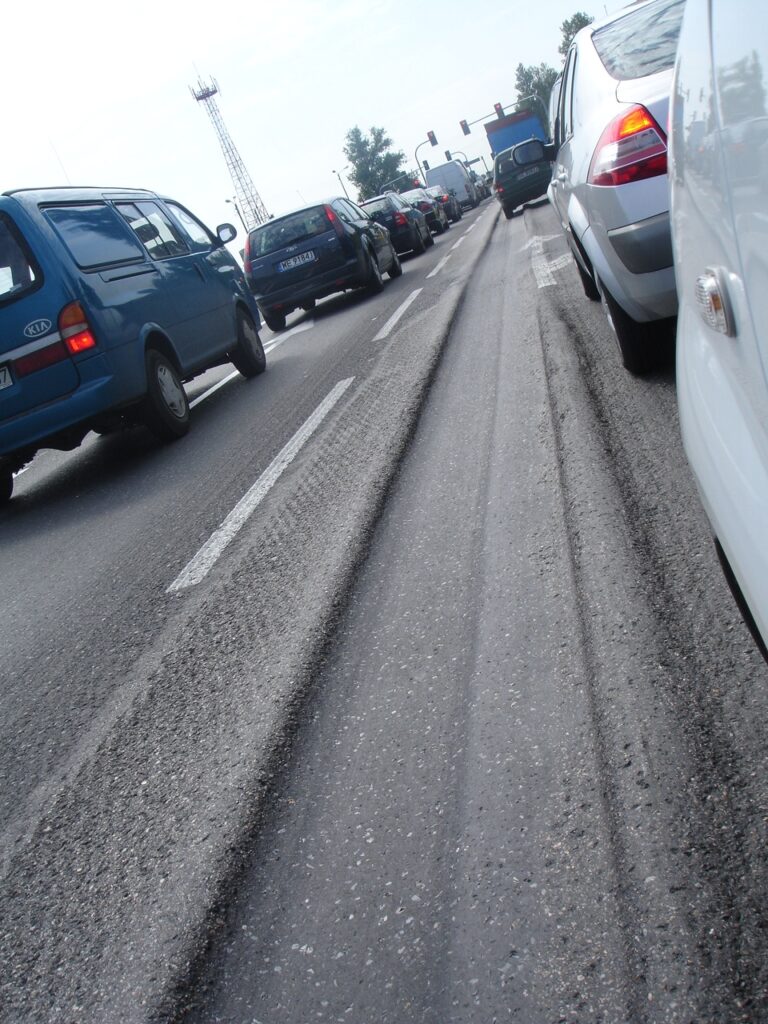 What causes a car to follow the ruts in the road?